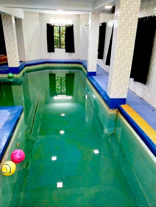 The indoor pool on the first floor, seen along its length